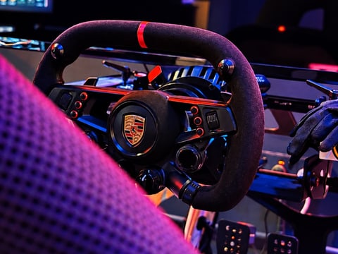 Porsche-branded racing wheel and pedals at Xerom
