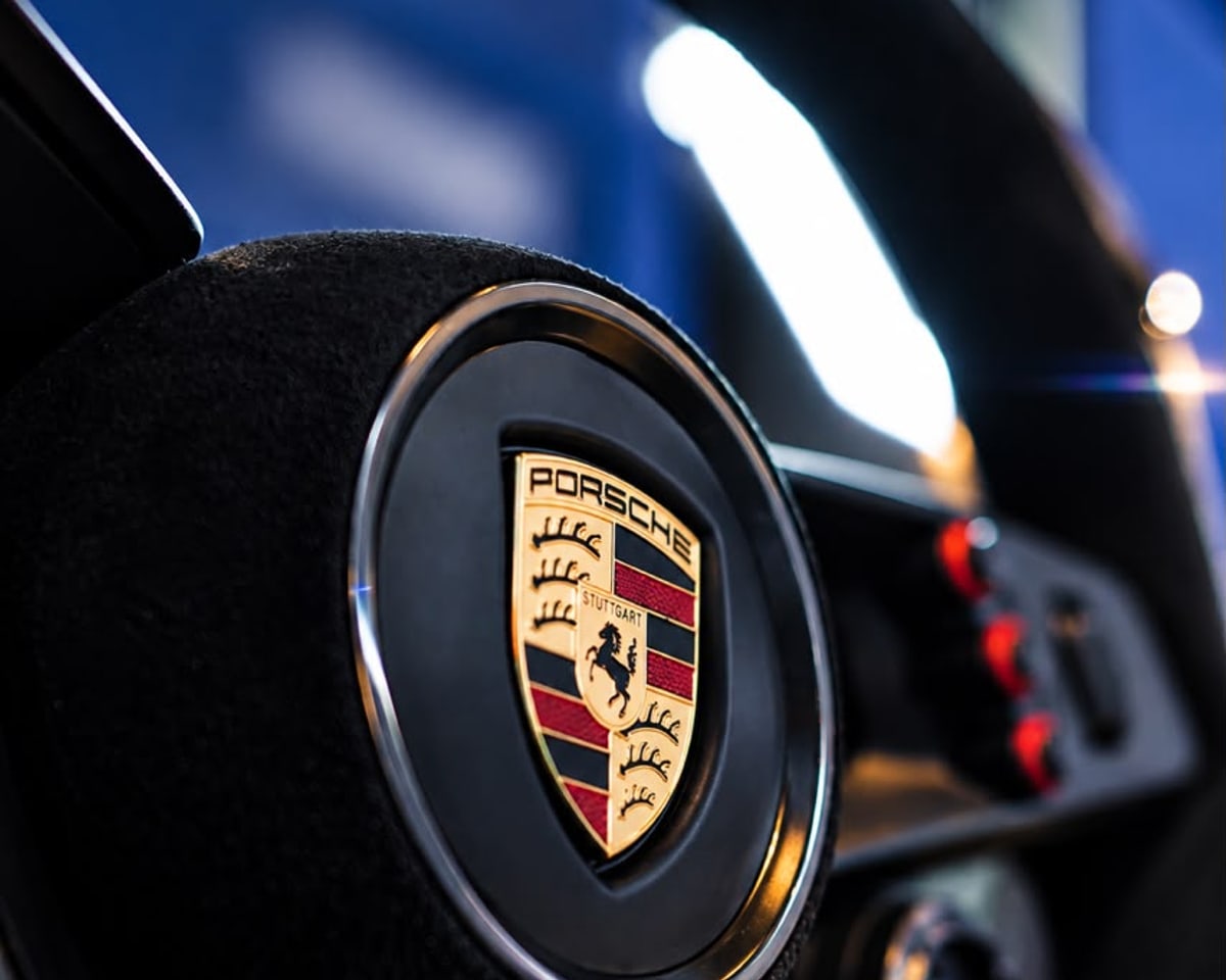 Close-up of a Porsche-branded racing wheel at Xerom