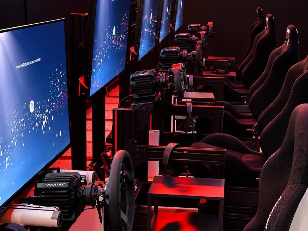 A row of sim racing rigs at Xerom